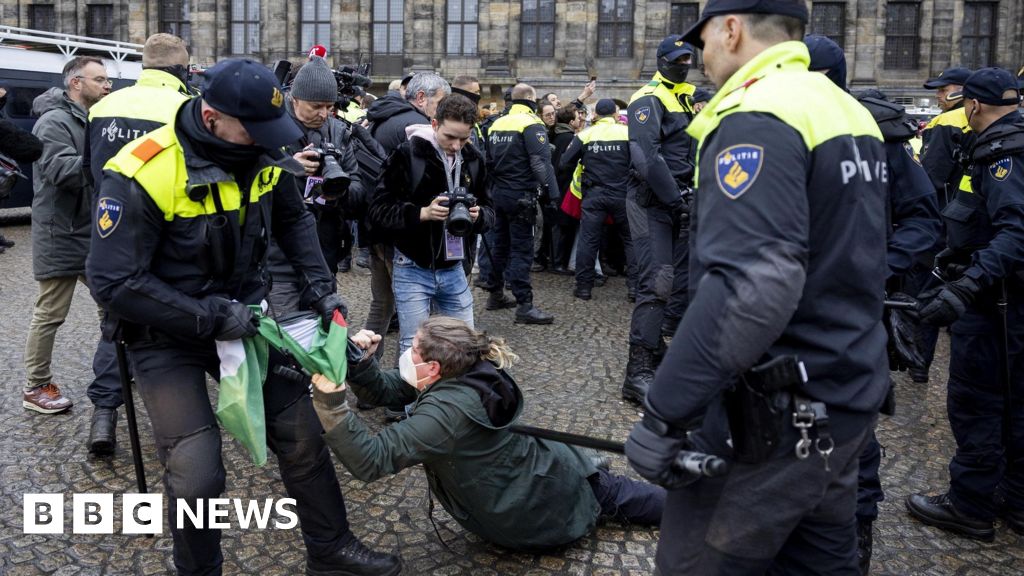 Dozens detained after protesters defy ban in Amsterdam