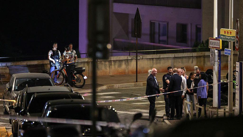 Police near the scene of the blast late at night on a Monaco street