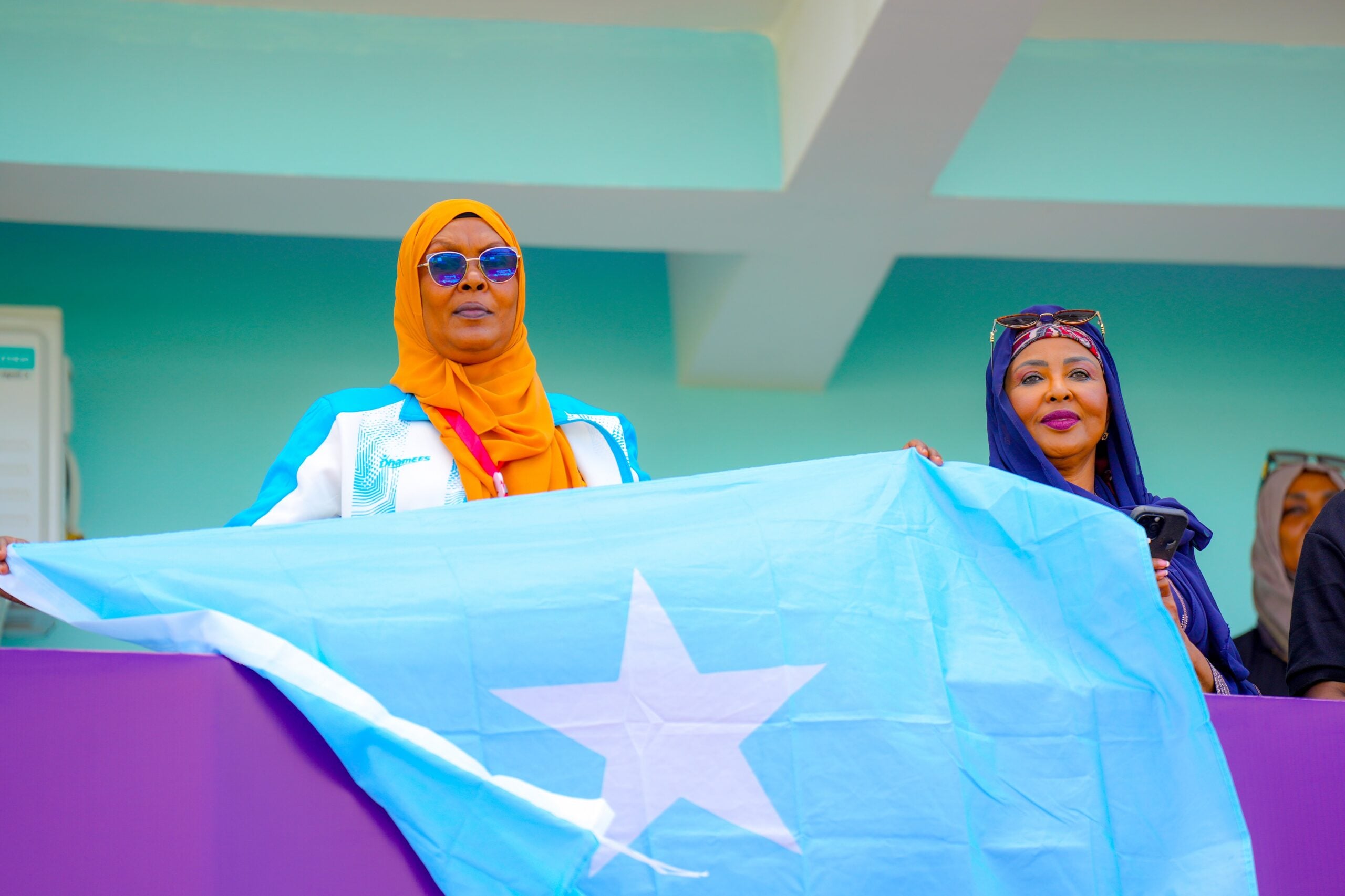 Somalia U-17 Women End Debut CECAFA Tournament With Historic 8-2 Win Over Sudan 2 Supporters hold a Somali flag during the CECAFA Women’s U-17 Championship.