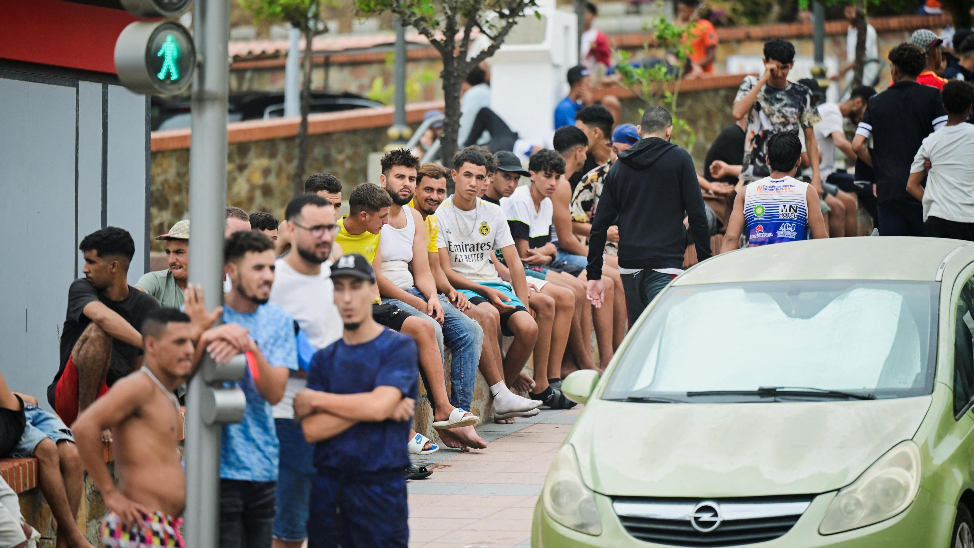 Migrants gather in downtown Ceuta, Spain, July 31, 2026, as migrants cross into Ceuta by sea and land.