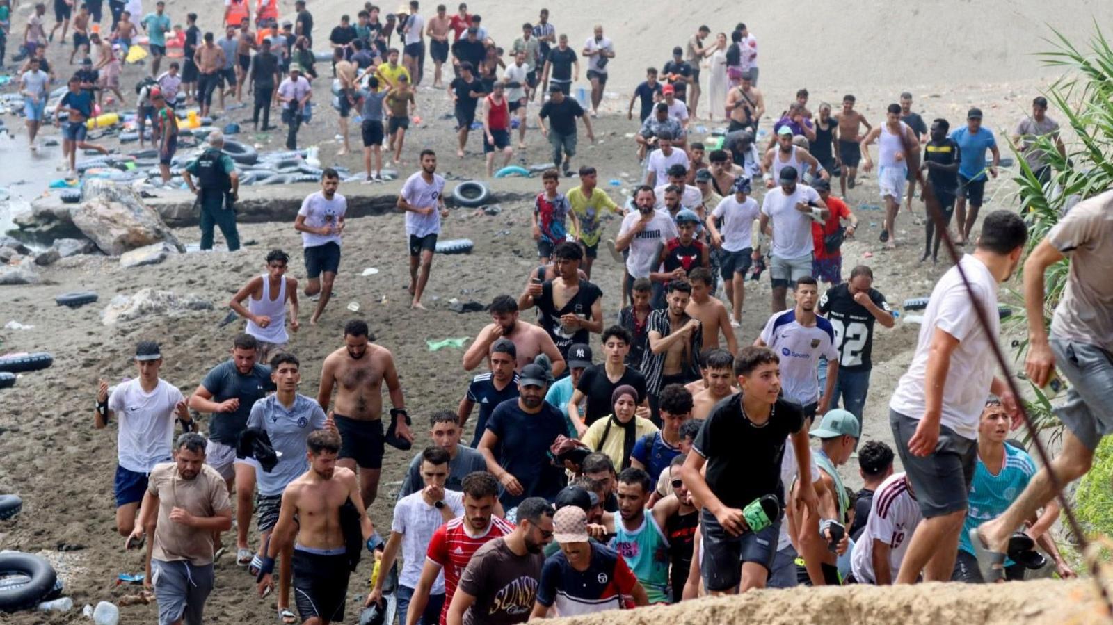 Migrants reach Spanish territory after swimming from Morocco to Ceuta, a Spanish enclave in North Africa, 30 July 2026.