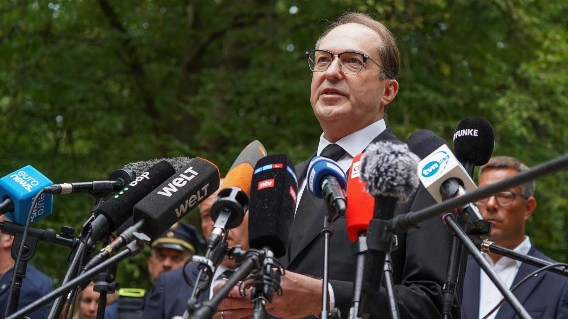 German Interior Minister Alexander Dobrindt speaks at a news conference near the scene where a vehicle plowed into a crowd on the sideline of the Christopher Street Day (CSD) parade in Berlin