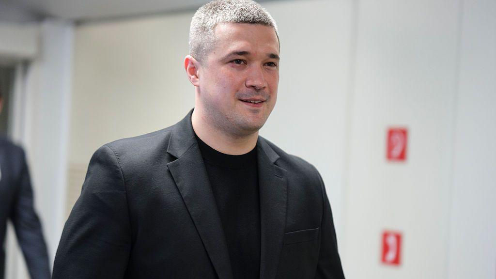 Mykhailo Fedorov - a man wearing a grey jacket and black top, with close-cropped grey hair