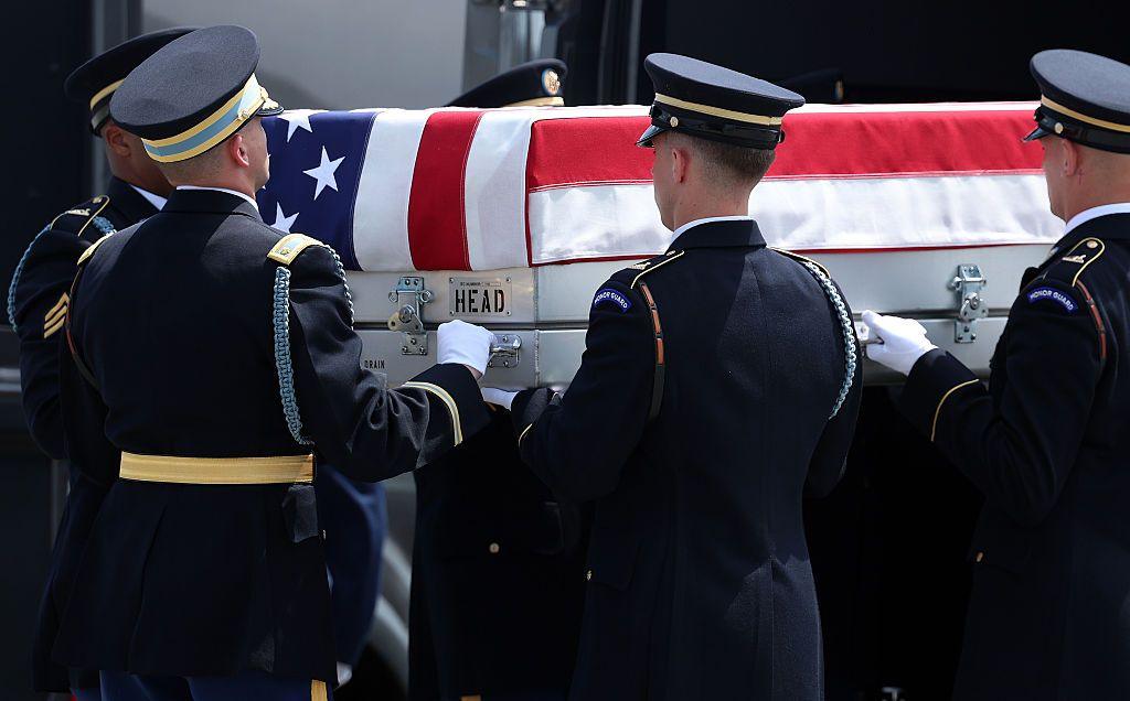 US soldiers carry a casket during a dignified transfer ceremony in Delaware in July