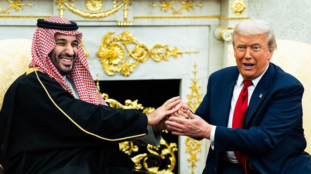 A file image of Saudi Crown Prince Mohammed bin Salman holding an extended handshake in the White House Oval Office with US President Donald Trump