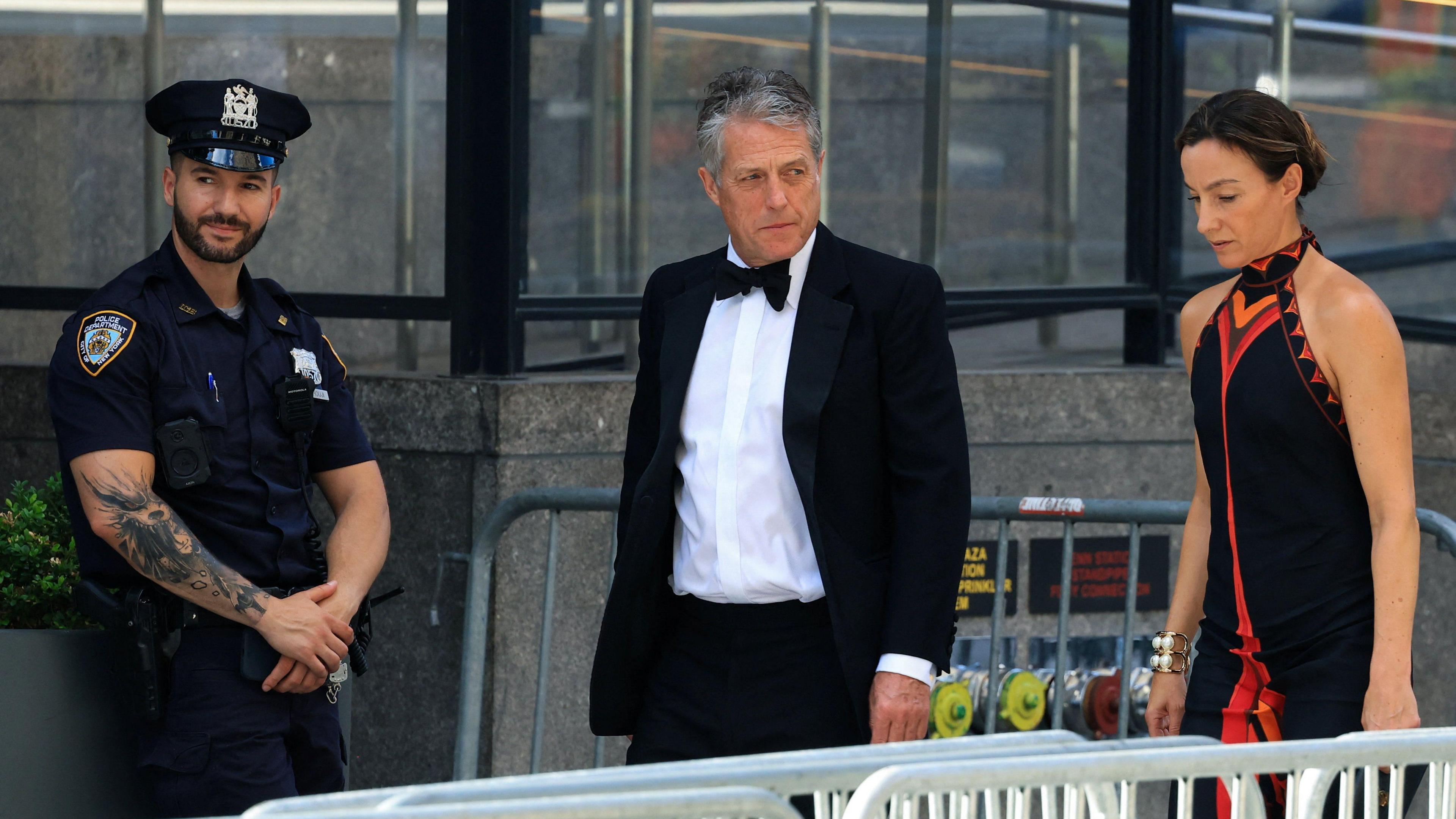 Actor Hugh Grant and wife Anna Elisabet Eberstein arrive at Madison Square Garden in formalwear.