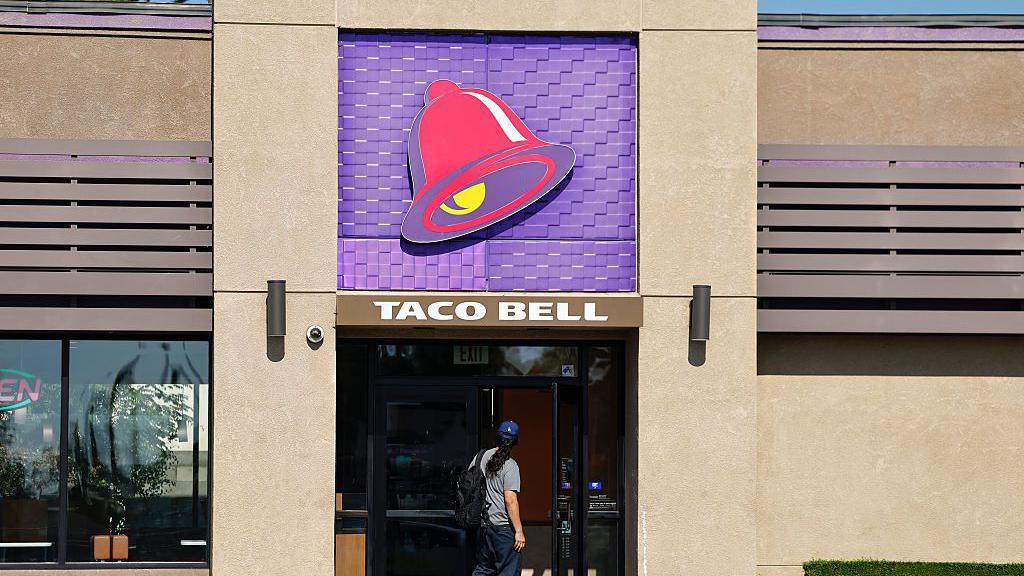 A person enters a Taco Bell restaurant on July 14, 2026 in Pasadena, California.