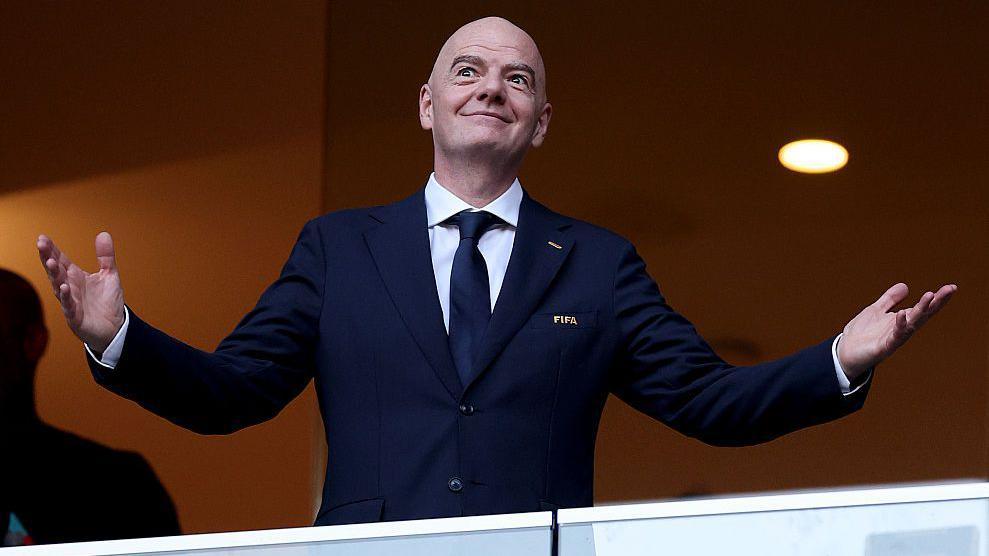 Fifa president Gianni Infantino gestures with his arms out during the World Cup last 32 match between Netherlands and Morocco