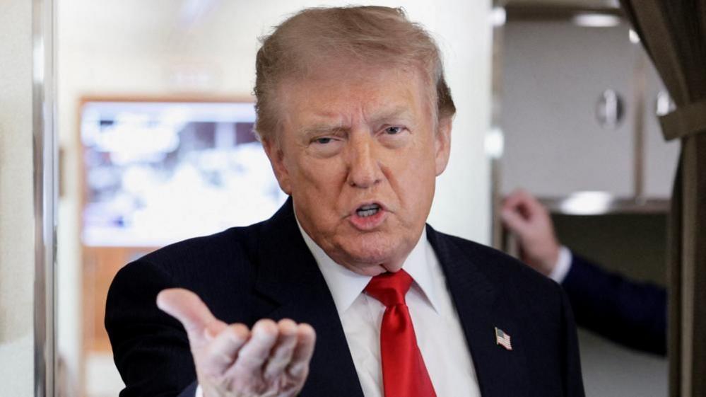 US President Donald Trumps speaks to reporters aboard Air Force One. Photo: 27 July 2026