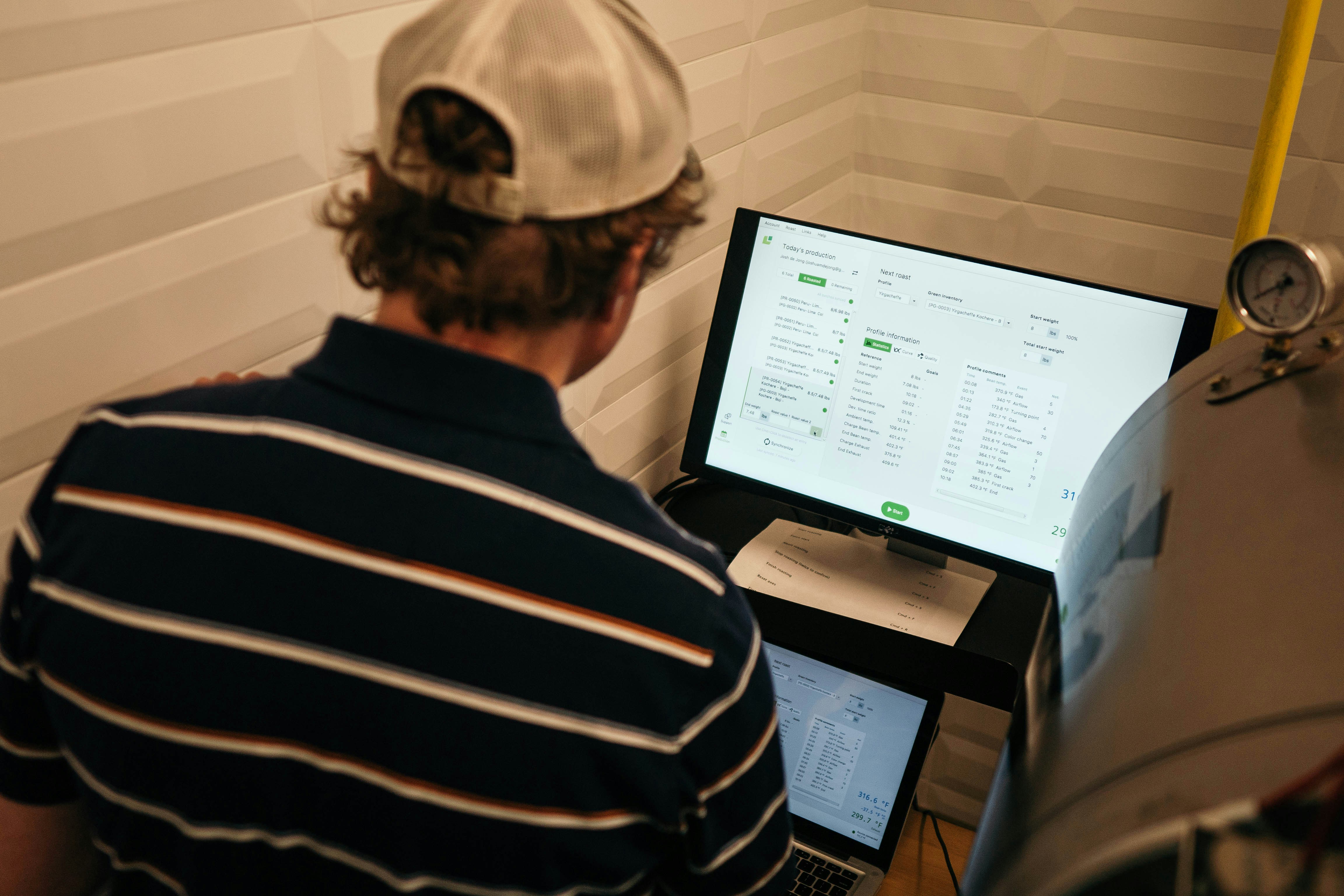 Upgrading Commercial Building Infrastructure for Modern Needs 2 technician monitoring building systems on a tablet