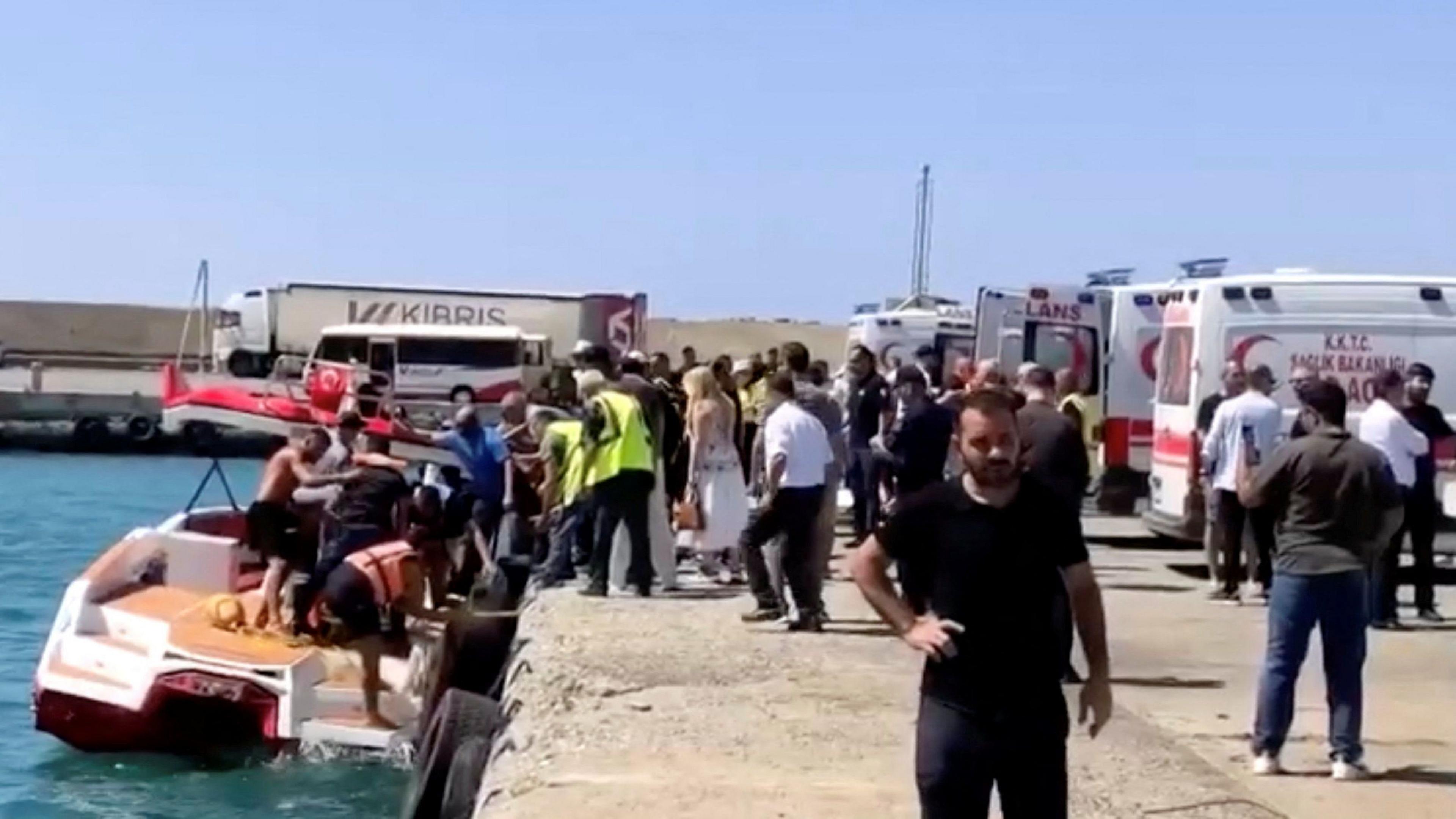 Rescue boats bring passengers to shore from a capsized boat in northern Cyprus, August 30, 2026 in this screengrab taken from a video.