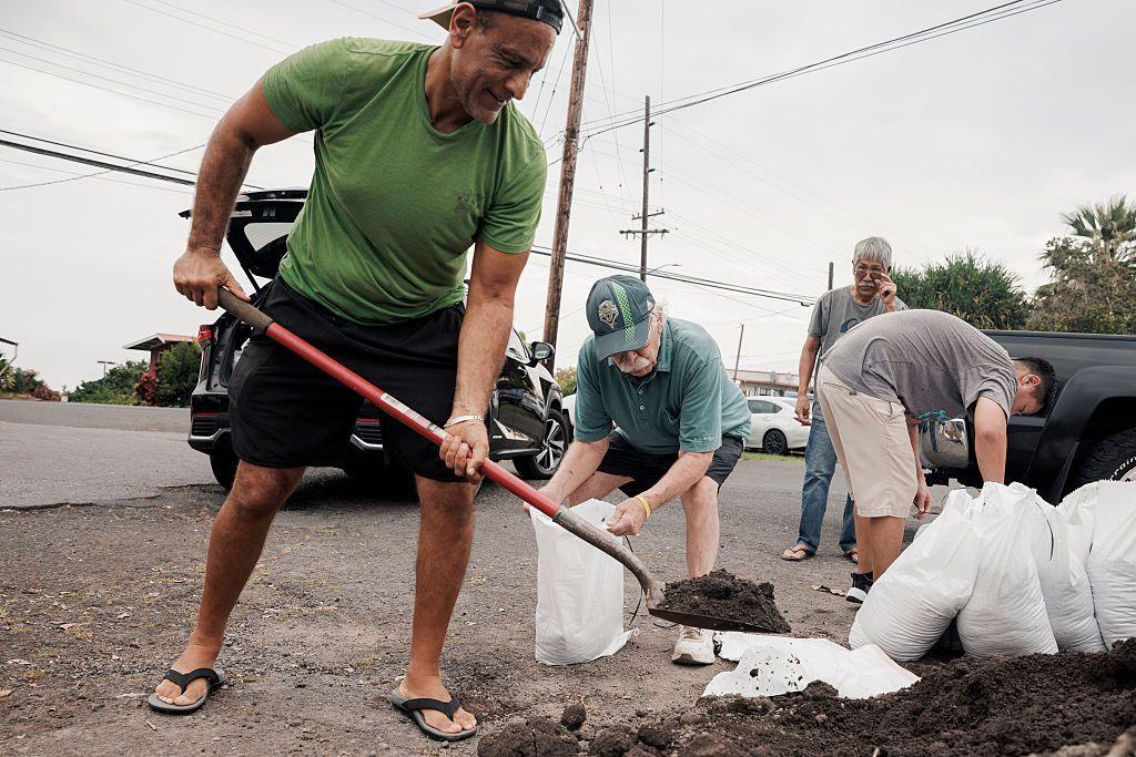 Captain Hook, Hawaii residents prepare stuff bags with sand in preparation of Tropical Storm Lala on Friday
