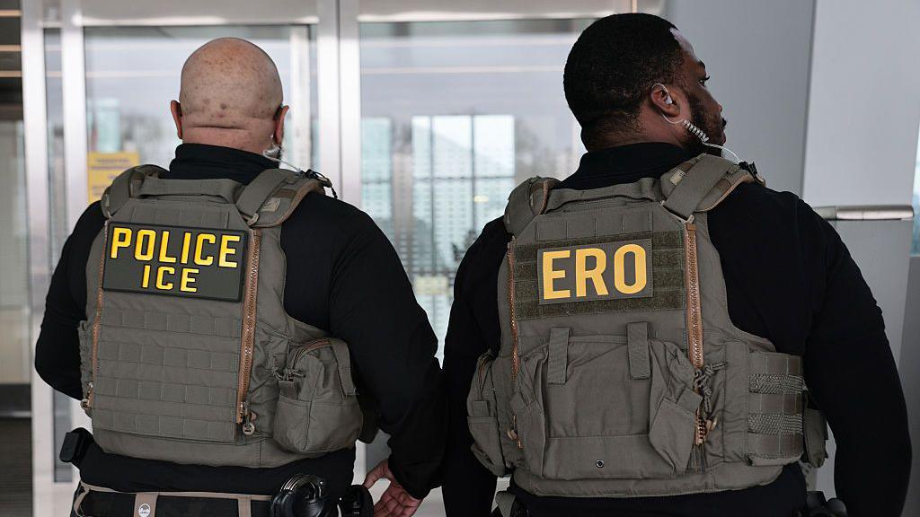 Immigration and Customs Enforcement (ICE) agents patrol Terminal B at LaGuardia Airport on March 23, 2026