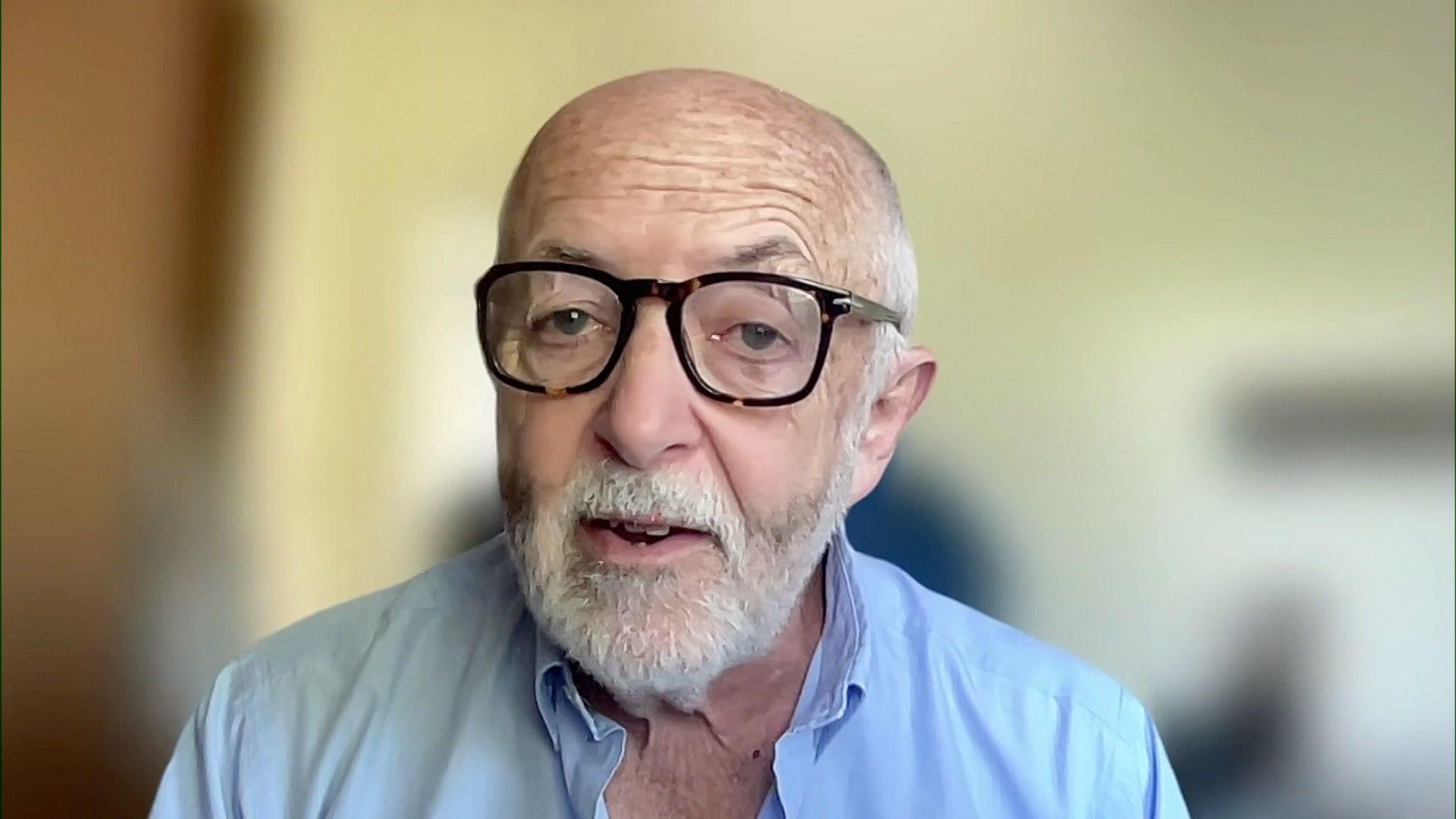 International editor Jeremy Bowen during remote interview wearing light blue shirt