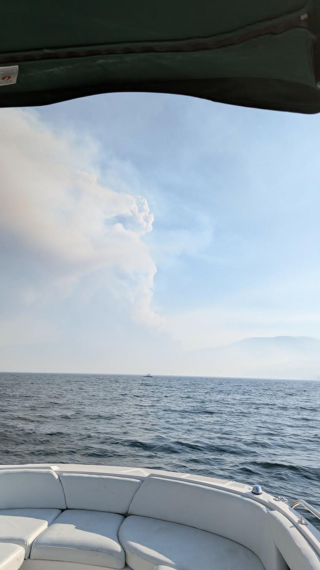 A view of wildfire smoke rising above Okanagan Lake in Canada
