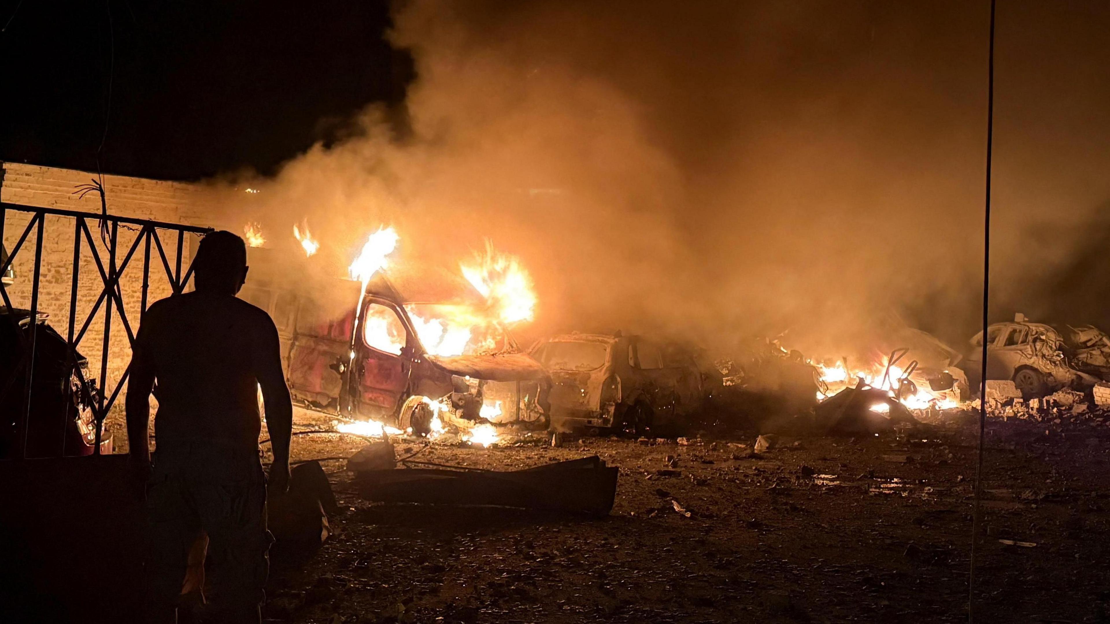 A resident stands at a site of an apartment building hit by a Russian missile strike, amid Russia's attack on Ukraine, in Kyiv, Ukraine August 20.