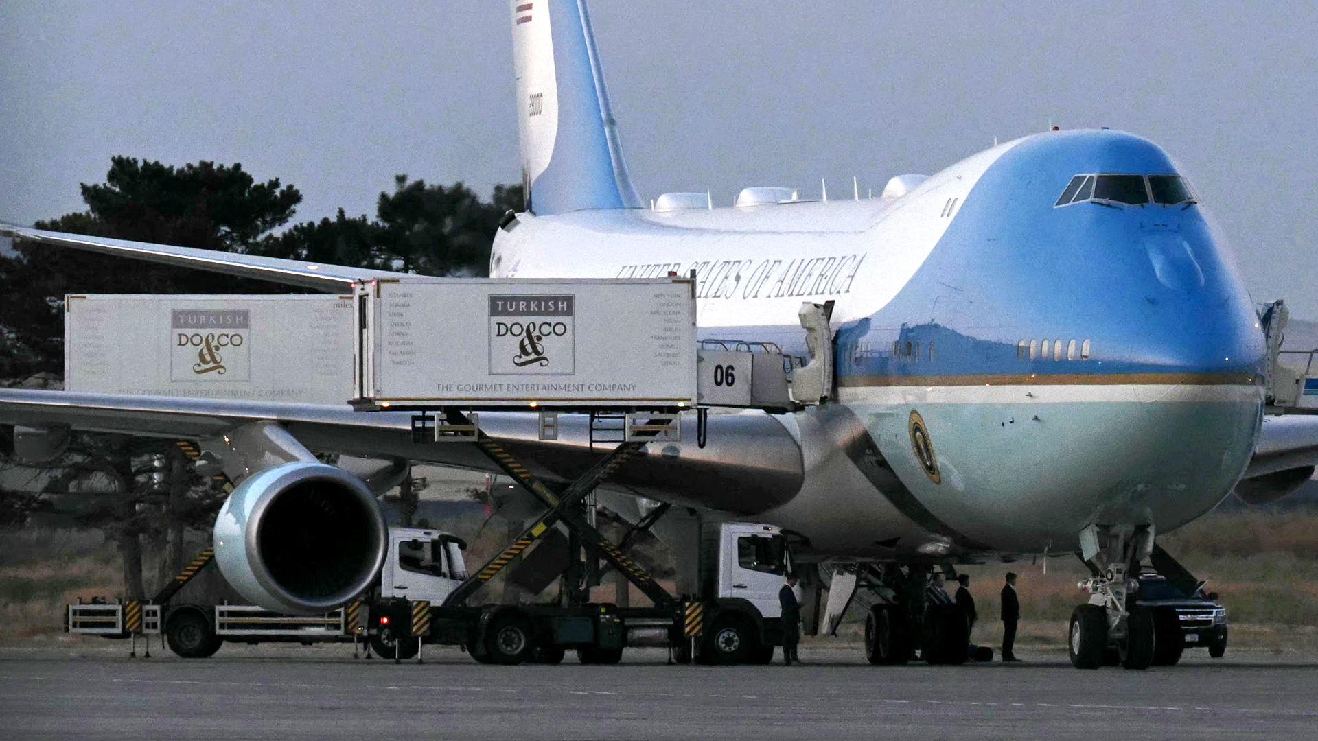 A catering truck parked alongside the old Air Force One jet prior to departure from Ankara