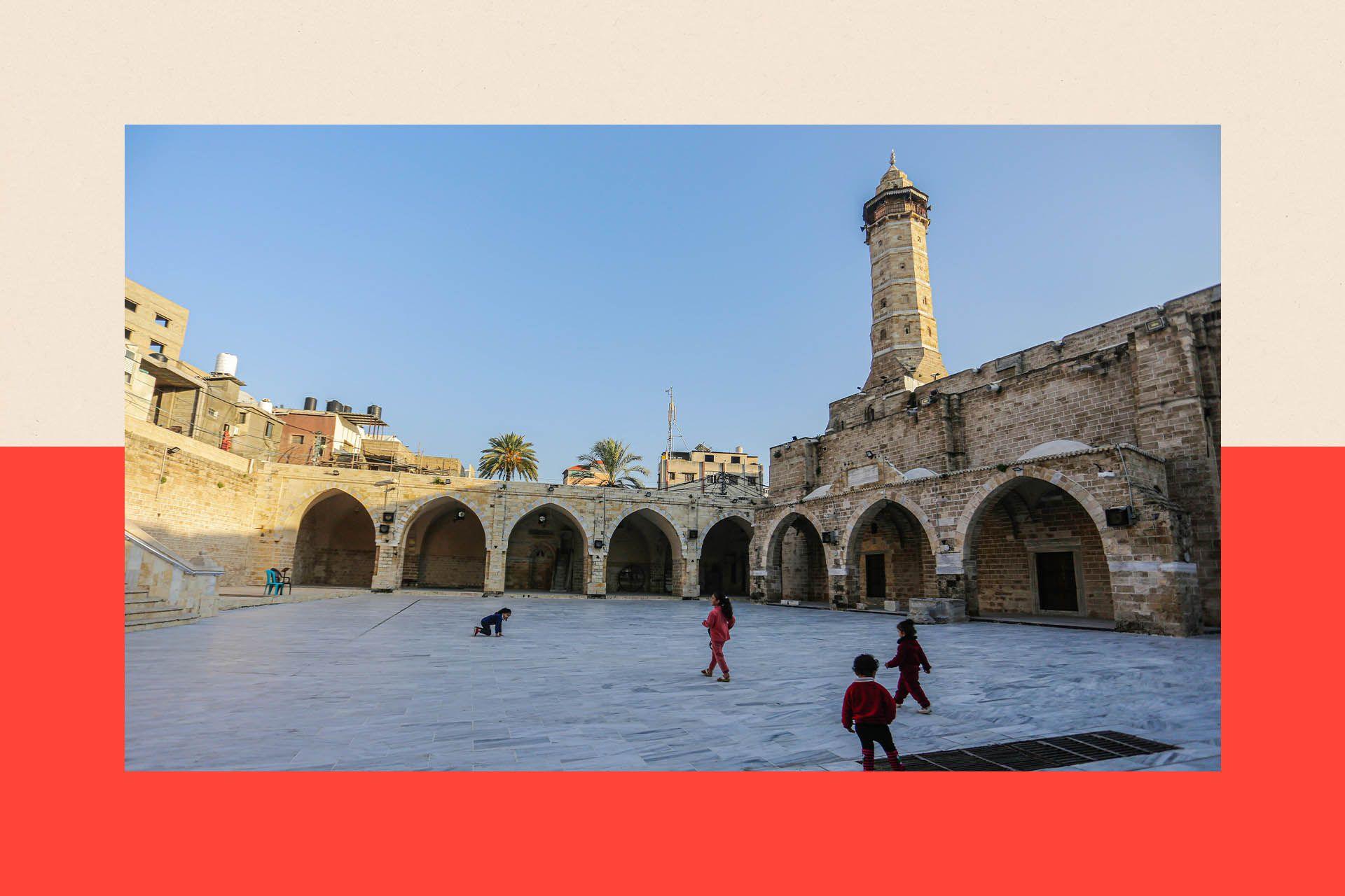 Palestinian children play in the courtyard of the Great Omari Mosque in Gaza City