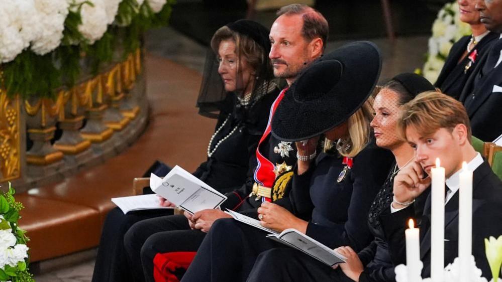 Norway's Queen Sonja, King Haakon, Queen Mette-Marit, Crown Princess Ingrid Alexandra, and Prince Sverre Magnus sit during the funeral ceremony of Norway's King Harald at Oslo Cathedral