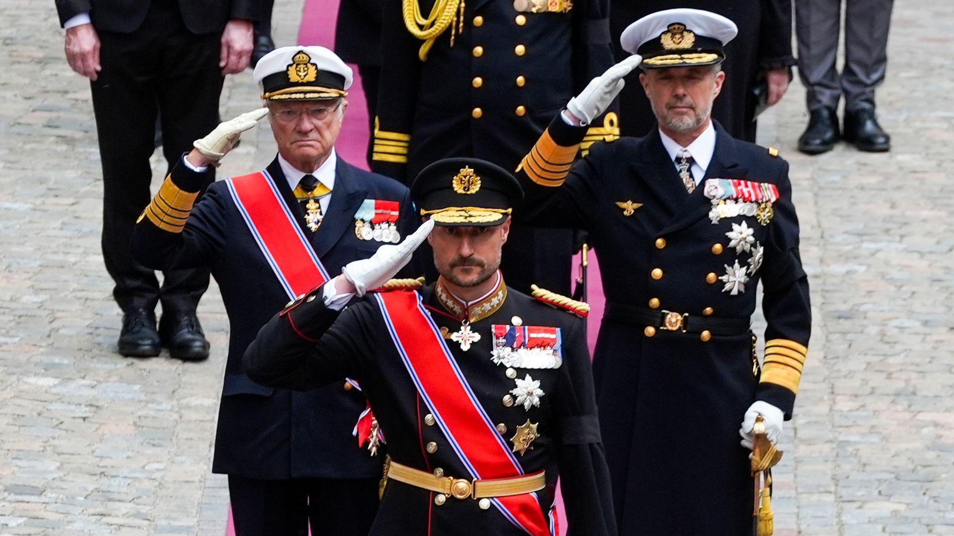 Norway's King Haakon VIII, King Carl Gustaf XVI of Sweden and King Frederik X of Denmark greet the coffi of Norway's King Harald as it is taken to the royal mausoleum in the crypt at Akershus Castle after the funeral ceremony in Oslo Cathedral