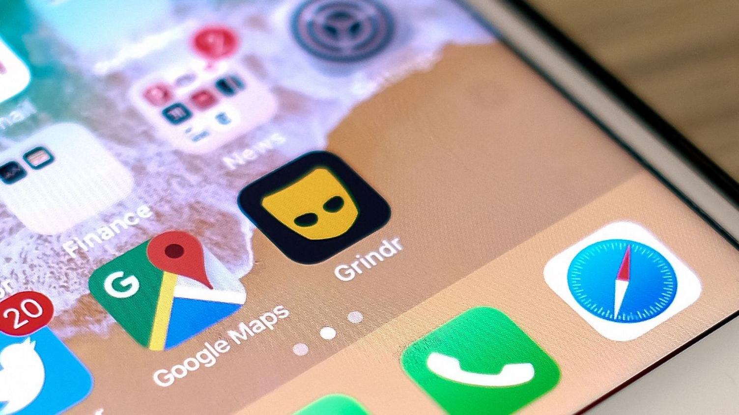 A phone screen with a series of apps and folders with apps in them. On the screen the apps which are displayed include X, formerly known as Twitter, Google Maps and Grindr.
