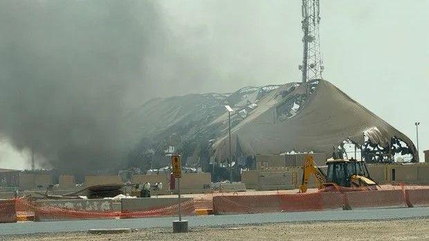 Undated photo shows smoke billowing from a structure that sustained damage in an Iranian strike at Camp Buehring, Kuwait.