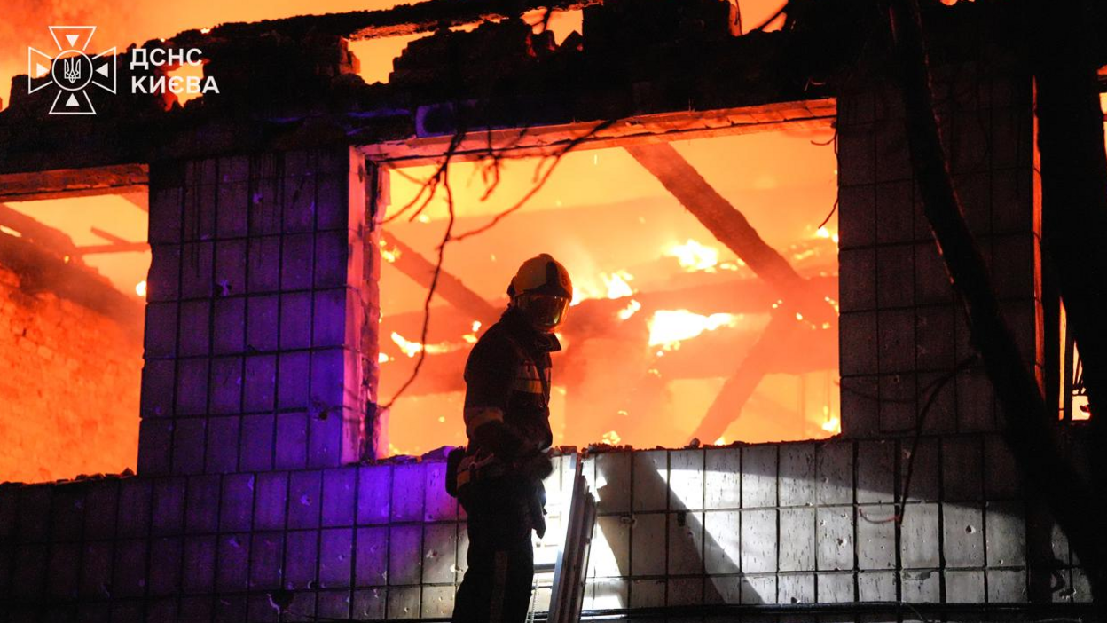 A firefighter tackles a fire in a building after overnight Russian strikes on Ukraine's capital Kyiv. Photo: 1 September 2026