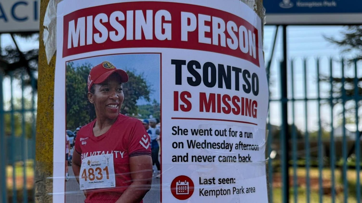 A missing person poster of Elizabeth Moselakgomo is seen near her home