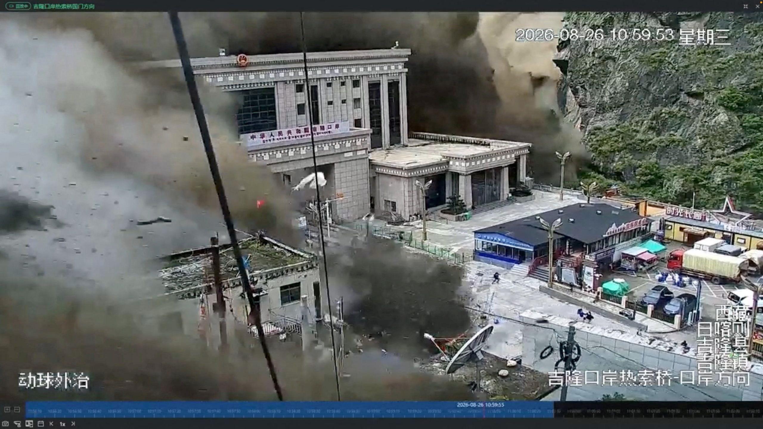 CCTV footage shows people fleeing as a wall of mud and water destroys buildings at the Nepal-China border in Gyirong, Tibet, China, on August 26, 2026.