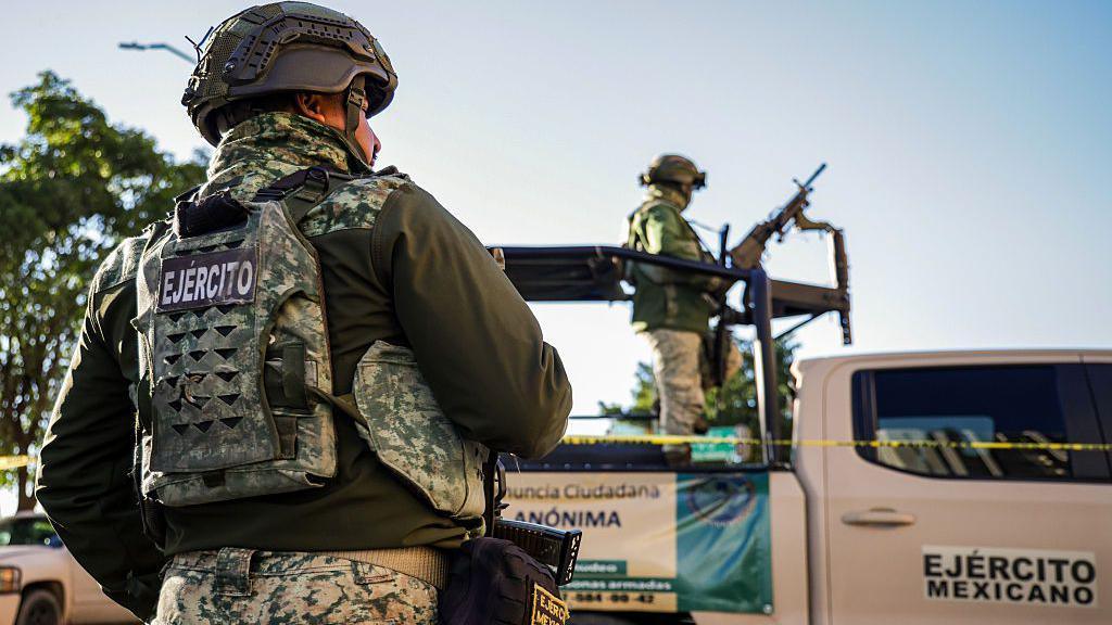 Mexican police at the scene of a murder in Sinaloa