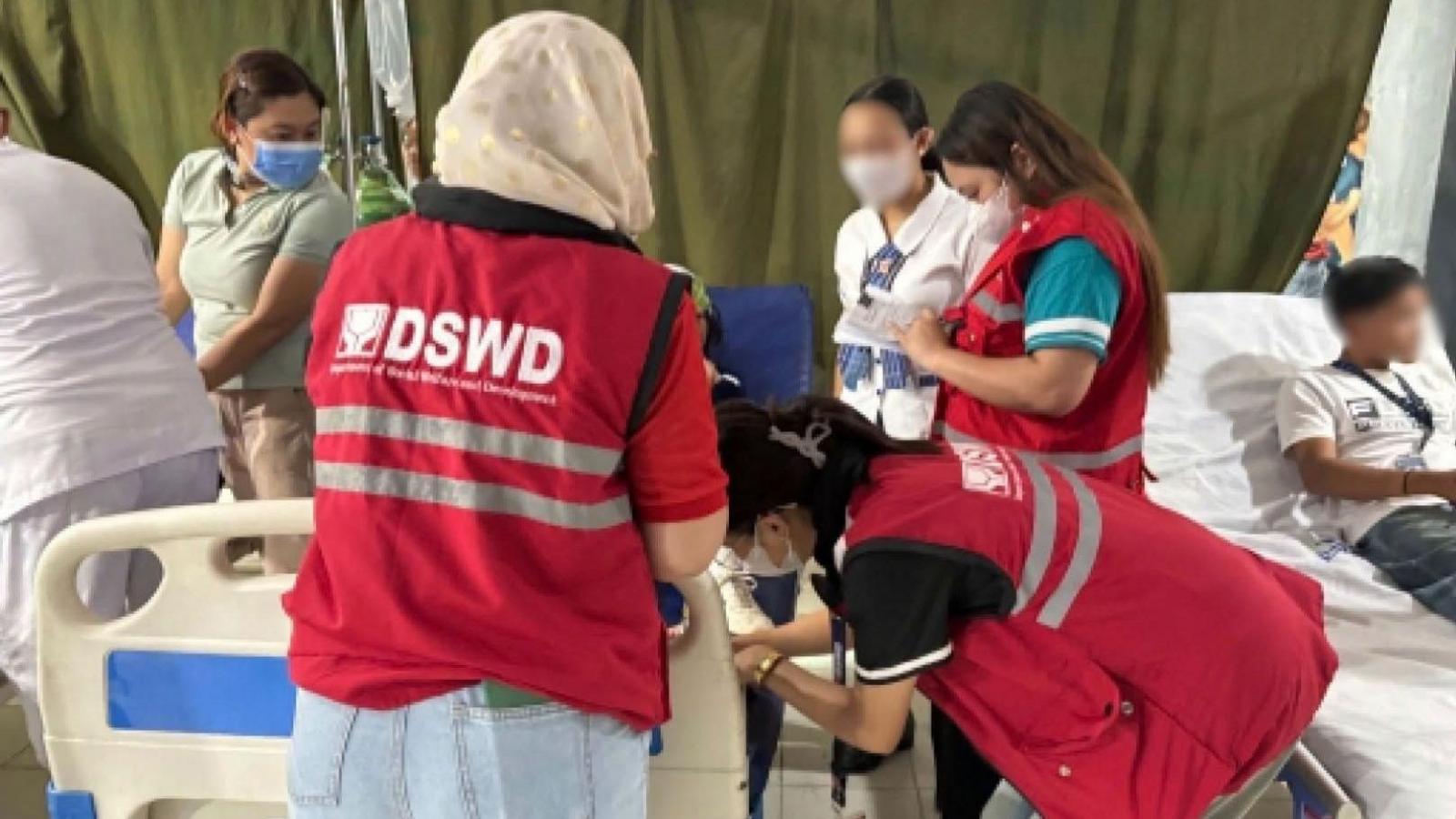 Officials from the Department of Social Welfare and Development attending to those injured in the hospital