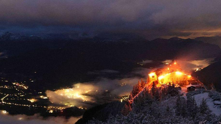An aerial web cam shot of the Eagle's Nest on fire in the dark and early hours of the morning.