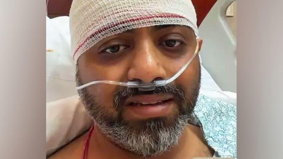 Image shows Capt Smit Matchhar with a bandage around his head and Indian Prime Minister Narendra Modi