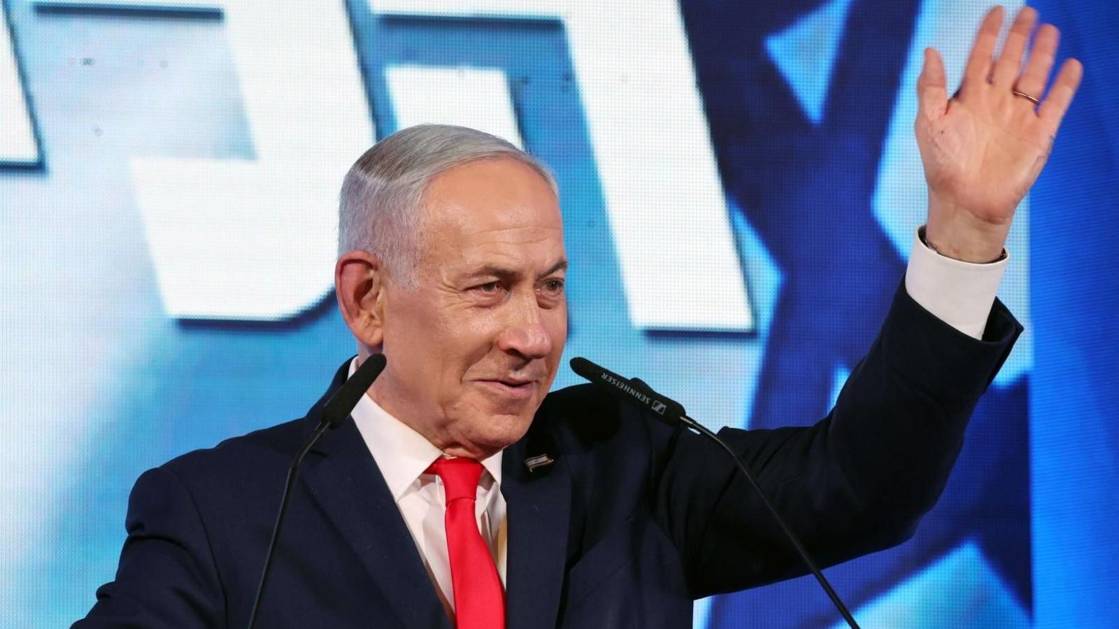 Israeli Prime Minister Benjamin Netanyahu waves while addressing supporters at his Likud party's headquarters in Jerusalem (28 October 2026)