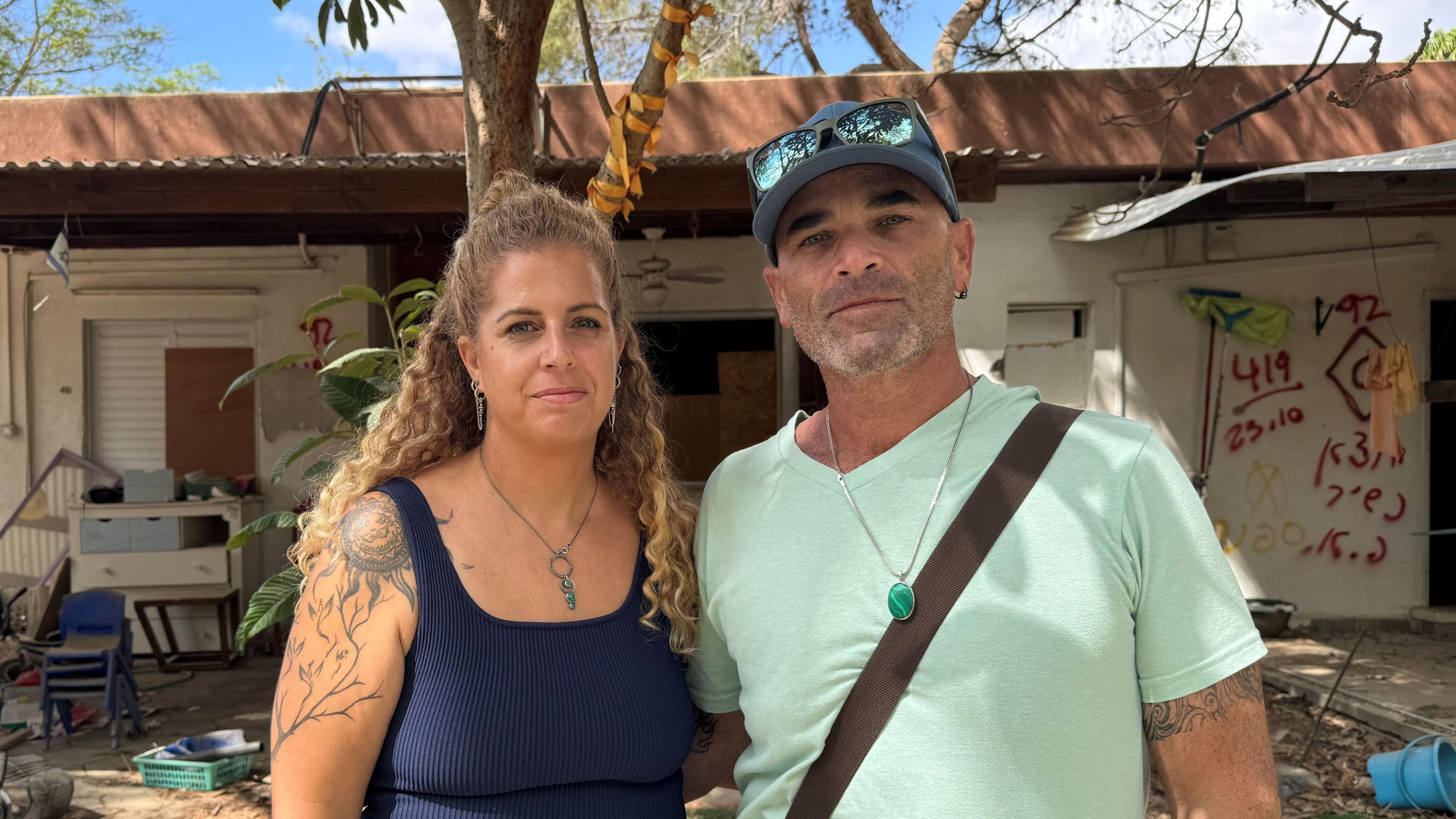 Dalit Ram Aharon and her husband Achi say they want to move back to Nir Oz "in the memory" of the friends they lost in the 7 October attacks
