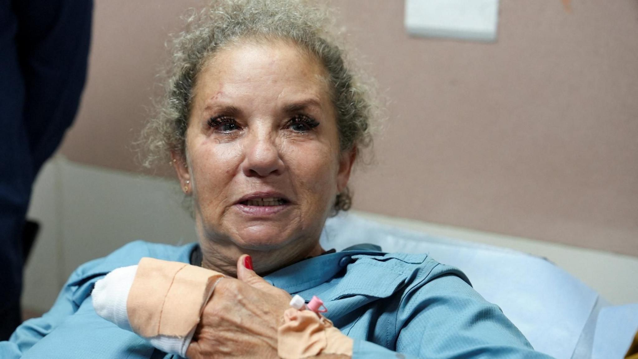 Washington Post photojournalist Heidi Levine speaks to reporters in hospital in Ramallah, in the occupied West Bank, after she was attacked by Israeli settlers in the village of Abu Falah (16 October 2026)