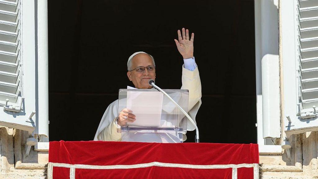 The Pope delivering a speech from a windowsill on Sunday
