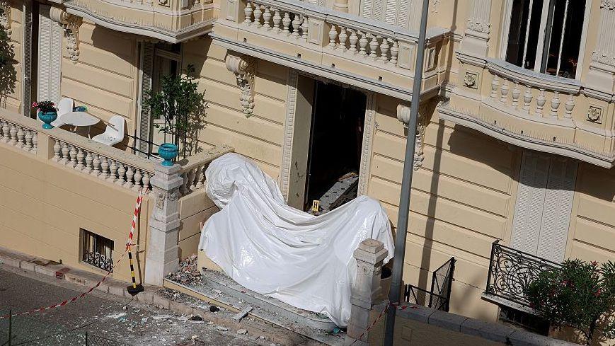 This photograph shows the entrance of a residential building as a bomb disposal team operates at the scene in Monaco on June 30, 2026, a day after an alleged attack involving an explosive device
