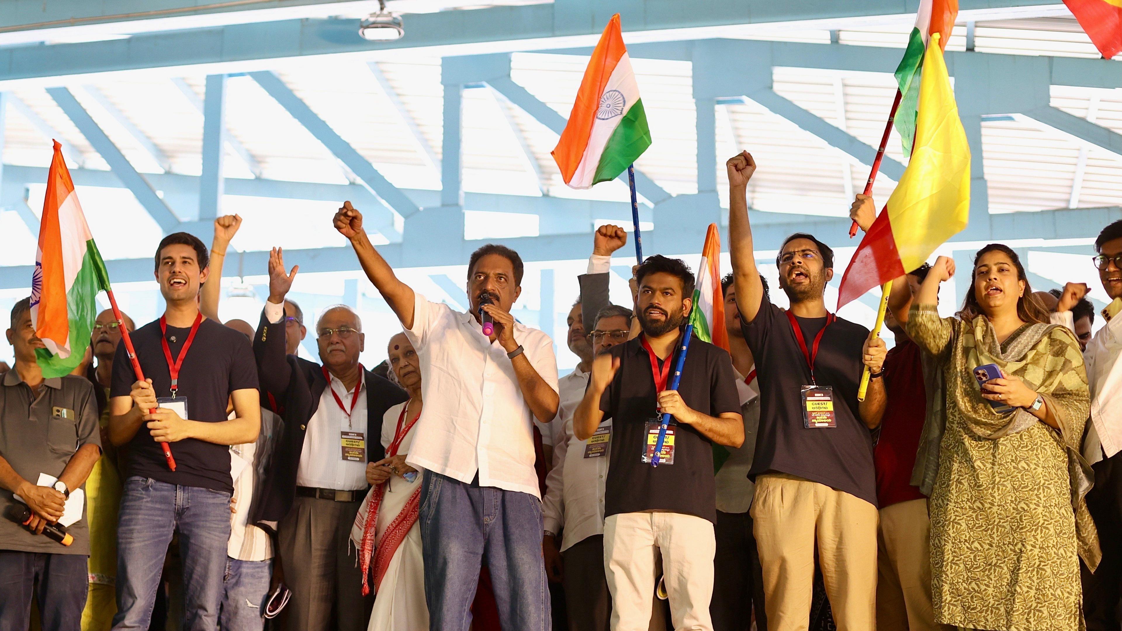YouTube influencer and political commentator Dhruv Rathee (L), Bollywood veteran actor Prakash Raj (C), Cockroach Janta Party (CJP) founder Abhijeet Dipke (R) and others participate in a protest against the central government over voter-list revisions in Bangalore, India, 08 October 2026