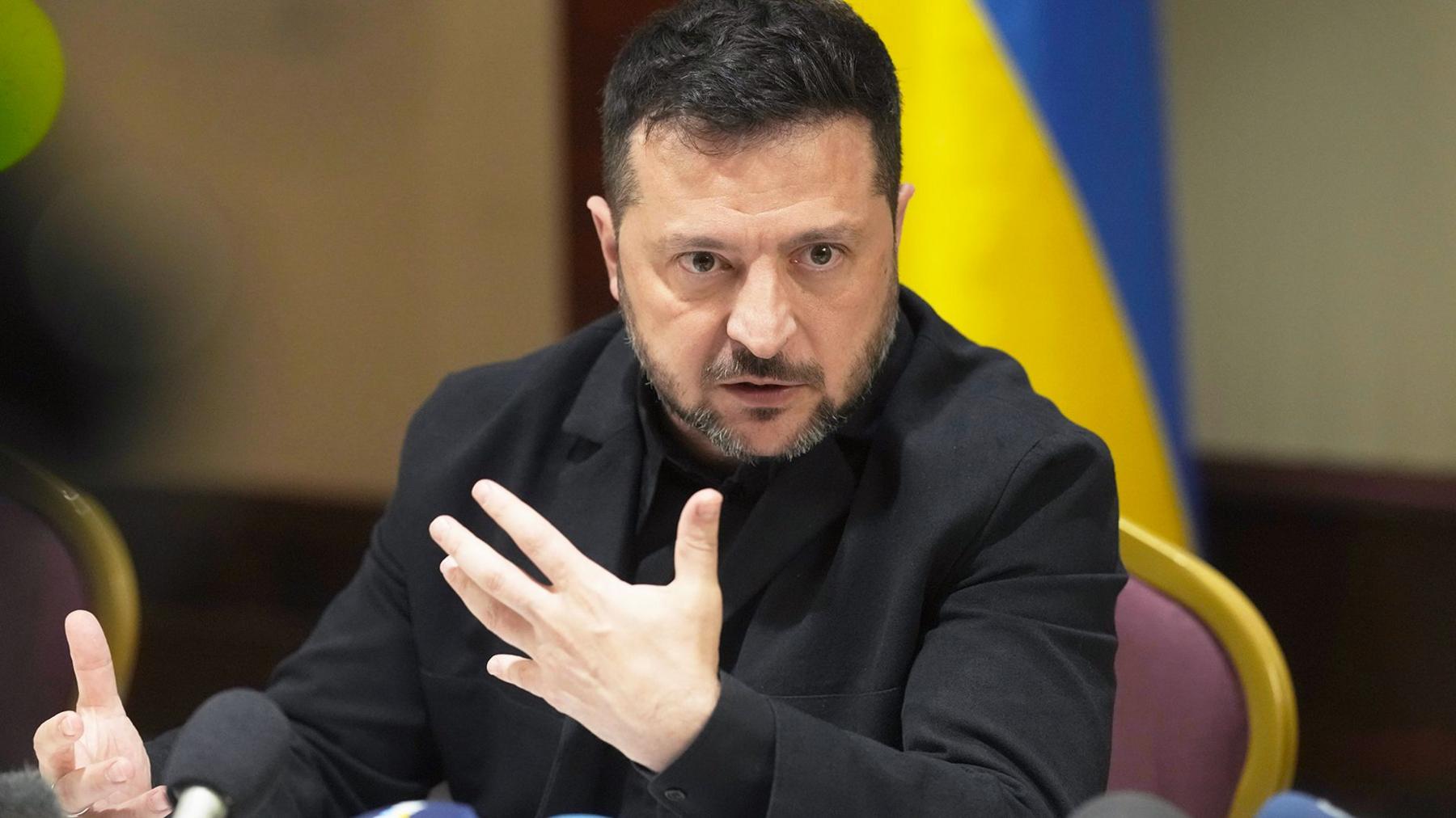 President Zelensky gesturing with his hands at a press conference