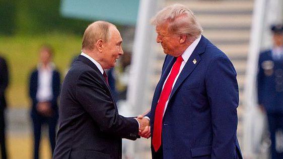 Putin and Trump shaking hands, with Air Force One in the background.