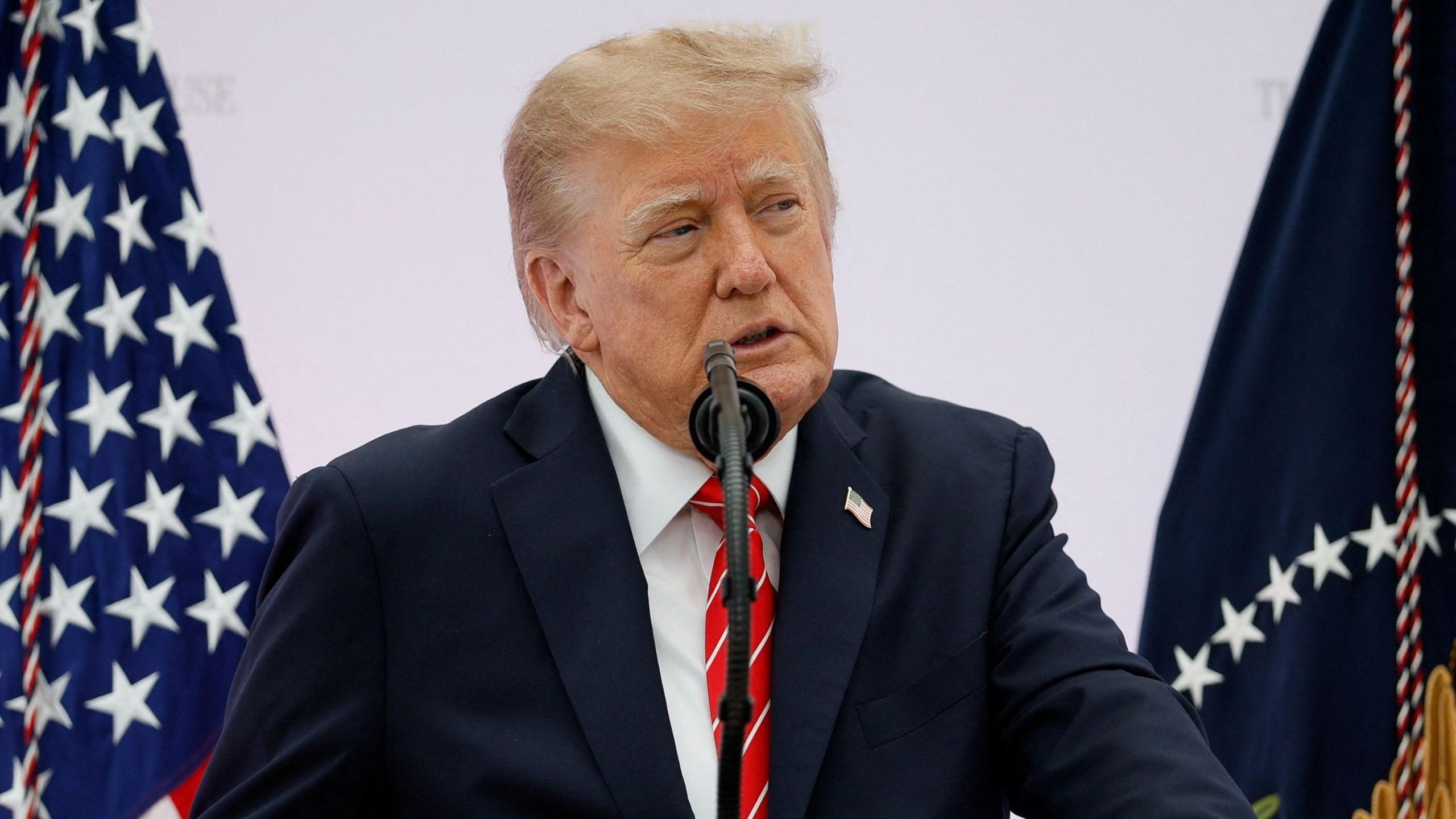 US President Donald Trump delivers remarks during the "A New Golden Age" summit at the US Institute of Peace
