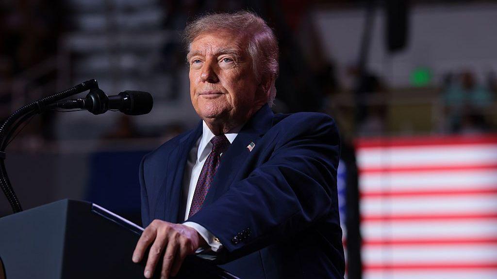 Donald Trump speaking at lecturn.